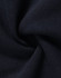 A close-up of navy fleece fabric showcasing its soft texture and smooth finish. The fabric has a subtle sheen.