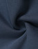 A close-up of soft, navy fleece fabric, showcasing its texture and smoothness, with a logo visible.