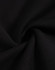 A close-up view of black fleece fabric, showcasing its soft texture and smooth finish.