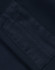 A close-up of a navy fleece fabric with a textured patch, featuring an area for branding or labels.