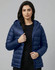 A lightweight hooded puffer jacket in navy blue, featuring a zip front and a branded logo.