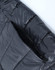 A black lightweight hooded puffer jacket featuring stitched details and an open zip pocket.