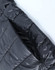 A black lightweight hooded puffer jacket with a zip closure and quilted design. It features a logo on the fabric.