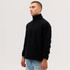 A side view of a black quarter-zip polar fleece top, featuring a stand-up collar and long sleeves.