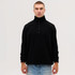 A black fleece 1/4 zip top on a model, featuring a high collar and long sleeves. There is a logo on the garment.