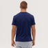 A navy blue T-shirt is displayed, featuring a plain back view and a fitted design. The model has short, brown hair.