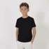 A black youth tee displayed on a child, standing with hands in pockets against a plain background.
