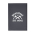 A refillable journal with a dark cover featuring a logo and graphic of crossed axes.