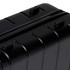 A black hardcase trolley with ridged design, featuring multiple zippers and handles.