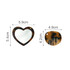 A heart-shaped acetate mirror and comb keyring in brown tones, featuring a small hole for attachment.