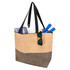 A large zipped tote in natural and black tones, featuring sunglasses and items like towels and utensils inside.