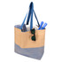 A large zipped tote bag in beige and blue, featuring sunglasses, a towel, and utensils inside.