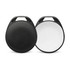 A pair of round Bluetooth trackers in black and white, featuring a textured surface and a hole for attachment.