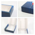 A blue custom flip-top gift box featuring a square window, with an open design showcasing the interior.