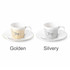 A coffee mug set featuring two dynamic ceramic mugs in golden and silvery finishes, each with a matching saucer and branding.
