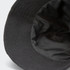 A black terry towelling bucket hat featuring a soft inner lining and a logo.