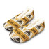 A pair of custom knitted slippers in cream, brown, and mustard yellow with a festive pattern.