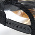 A black trucker cap featuring a mesh back and an adjustable strap with multiple snap options.