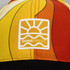 A vibrant multi-coloured cap featuring a logo with a sun and wave design.