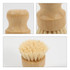 A bamboo kitchen dish brush featuring a wooden handle and bristles, with a natural finish and a rounded design.