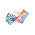 A satin long scarf featuring vibrant colours and a tropical design with greens, pinks, and oranges. It has a logo.