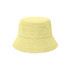 A yellow dual-material reversible bucket hat with a textured fabric design. It features a simple shape and wide brim.