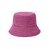 A reversible bucket hat in a vibrant pink colour, featuring a textured fabric and a logo.