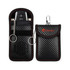 A black carbon fibre key pouch with red stitching, featuring a clip and keyring attachment, and a branded logo.