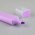 A purple highlighter with a chisel tip and a translucent cap placed nearby. The product has a smooth, sleek design.