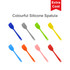A colourful silicone spatula set featuring eight spatulas in grey, green, blue, yellow, orange, and pink. Has a logo.