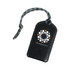 A black luggage tag with a textured finish and a cord, featuring a logo on the front.