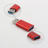 A red USB data blocker with two ends featuring USB ports. Includes a logo on the surface.