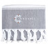 A grey towel with white fringe detailing and a logo printed on it.