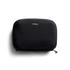 A black tech kit with a zip closure and a logo on the front, featuring a sleek, minimalist design.