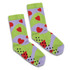 Bright green and lavender socks featuring red hearts and black non-slip grips on the soles, with a playful design.