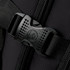 A close-up of a black buckle and strap on a backpack, showcasing its sturdy design and material.