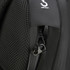 A close-up of a black backpack featuring a zippered pocket and an anti-theft clip.
