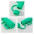 A cup-shaped silicone straw cover in vibrant green, featuring a handle and a hollow sleeve for a straw. It has a logo.