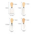 A bamboo cheese board knife set with four stainless steel knives, featuring wooden handles in a natural finish.