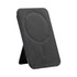 A black phone stand with a circular magnetised area and stitching details, featuring a logo on the surface.