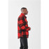 A unisex caribou fleece jacket in red and black check pattern, featuring a collar and side view.