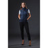 A navy women's puffer vest is displayed on a model, featuring a sleek design and a logo. The model wears black pants and heels.