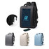 A carry-on travel backpack in black with a logo, featuring a USB port, shown alongside grey, cream, and blue versions.