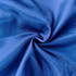A close-up of soft, textured blue fabric, showcasing a smooth, shiny surface with a subtle sheen.
