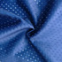 A close-up of a blue, perforated fabric, showcasing its texture and sheen. The material appears lightweight and smooth.