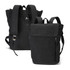 A black canvas backpack with adjustable straps and a front zipper pocket. It features a logo on the tag.