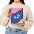 A woman holds a custom box with a locking lid, featuring pink, blue, and brown colours and a logo on the front.