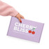 A hand holding a purple box with a locking lid, featuring a logo and cherry graphic.