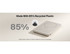 A slim white power bank with a circular design and an unobtrusive logo, made from 85% recycled plastic.