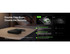 A power bank with integrated cable, featuring a black exterior and a logo, placed on a bedside table.